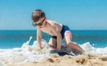 Kid playing at beach